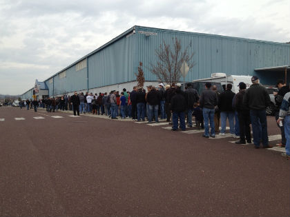 Gun enthusiasts line up to get inside a gun show at the Greater Philadelphia Expo Center. (credit: Pat Loeb)