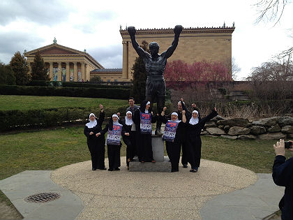 The women pose with the Rocky Statue (credit: John McDevitt)