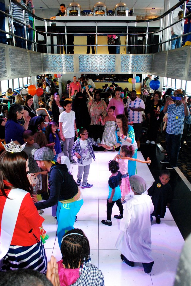 (Children and parents enjoy dancing aboard the 