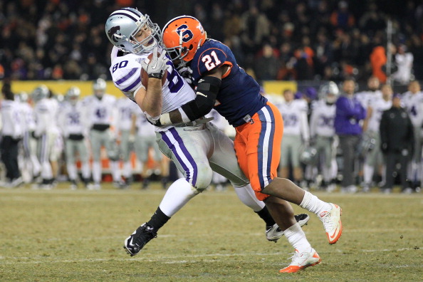NEW YORK, NY - DECEMBER 30: Travis Tannahill #80 of the Kansas State Wildcats is tackled by Thomas Shamarko #21 of the Syracuse Orange during the New Era Pinstripe Bowl at Yankee Stadium on December 30, 2010 in New York, New York. (Photo by Chris McGrath/Getty Images)