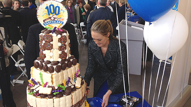 (A 100th-anniversary cake is made from a variety of Tastykake products.  Photo by John Ostapkovich)