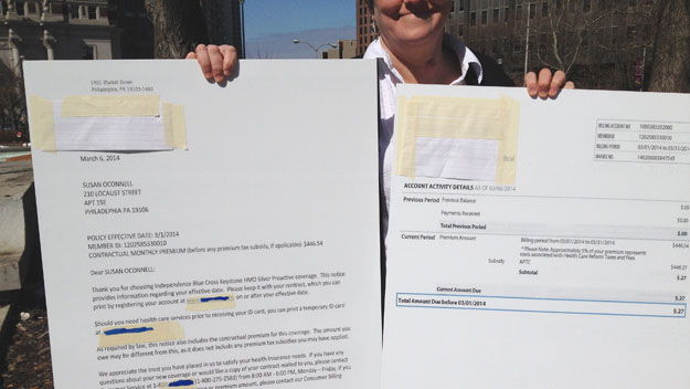 (Susan O'Connell shows an enlargement of her enrollment letter and premium bill for 27¢.  Photo by Pat Loeb)