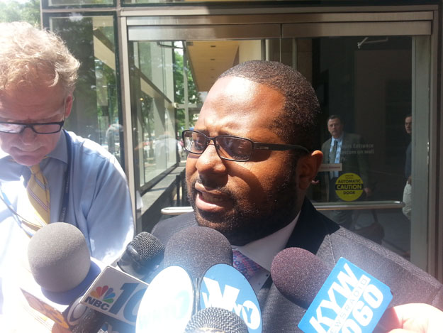 (Former judge Willie Singletary speaks with reporters after his acquittal on corruption charges in federal court.  He was convicted of lying to investigators.  Photo by Steve Tawa)