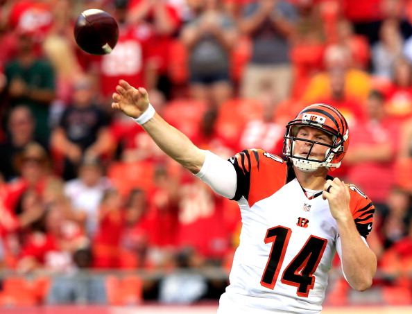Andy Dalton #14 of the Cincinnati Bengals drops back against the Kansas City Chiefs during the first quarter at Arrowhead Stadium on August 7, 2014 in Kansas City, Missouri.  (Photo by Jamie Squire/Getty Images)
