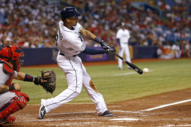 ST. PETERSBURG, FL - JUNE 10:  Desmond Jennings #8 of the Tampa Bay Rays grounds into the double play in front of catcher Yadier Molina #4 of the St. Louis Cardinals during the fifth inning of a game on June 10, 2014 at Tropicana Field in St. Petersburg, Florida.