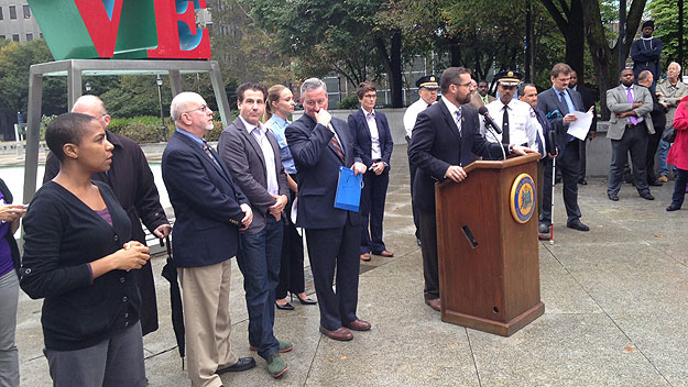 (Pa. state rep. Brian Sims addresses an anti-gay-bashing rally in Love Park.  Photo by Cherri Gregg)