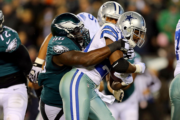 PHILADELPHIA, PA - DECEMBER 14: DeMarco Murray #29 of the Dallas Cowboys gets tackled by Bennie Logan #96 of the Philadelphia Eagles at Lincoln Financial Field on December 14, 2014 in Philadelphia, Pennsylvania. (Photo by Elsa/Getty Images)