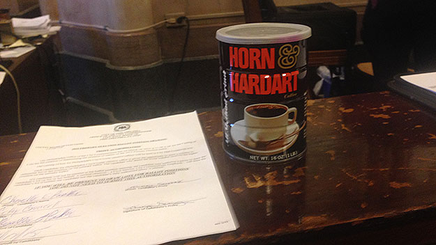 (THE SOURCE OF HOPES AND DREAMS.  Candidates picked their ballot numbers out of this coffee can.  Photo by Mike Dunn)