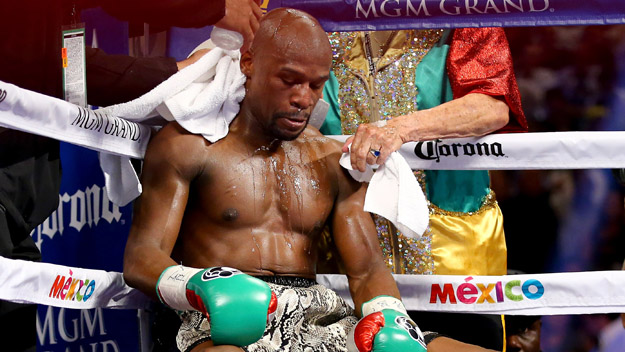 Floyd Mayweather Jr. sits in corner during a break between rounds while taking on Marcos Maidana.