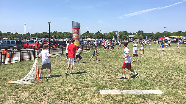 (KIds play lacrosse outside Lincoln FInancial Field, where the NCAA men's finals are being held.  Photo by Ian Bush)