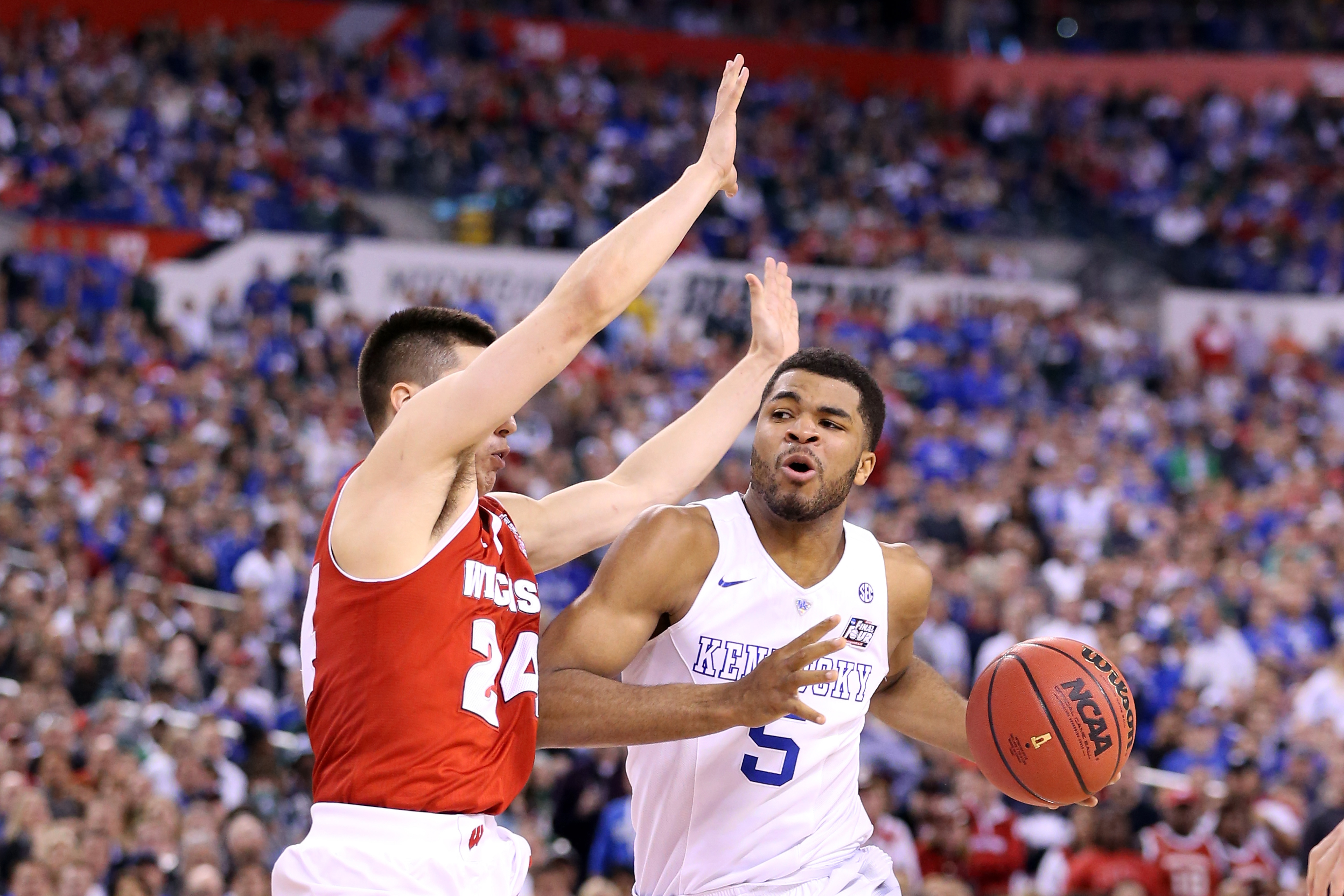INDIANAPOLIS, IN - APRIL 04: Andrew Harrison #5 of the Kentucky Wildcats handles the ball against Bronson Koenig #24 of the Wisconsin Badgers in the second half during the NCAA Men's Final Four Semifinal at Lucas Oil Stadium on April 4, 2015 in Indianapolis, Indiana.  (Photo by Andy Lyons/Getty Images)