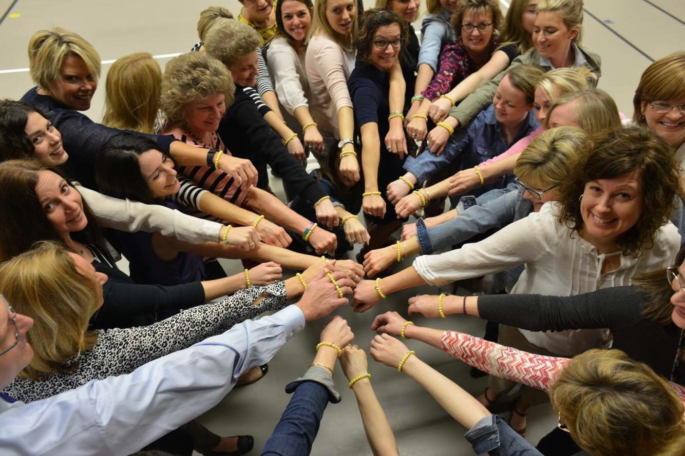 Faculty at West Vincent Elementary wear their "Bee Mighty" bracelets to show support for Mia.