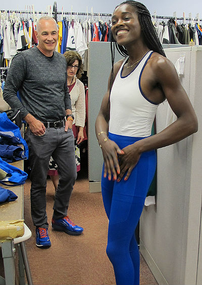 Mark Sunderland looks on as Philly born Chierika Ukogo tries on the unisuit.  will be the first rower ever to represent Nigeria in the Olympics. (Credit: Philadelphia University) 